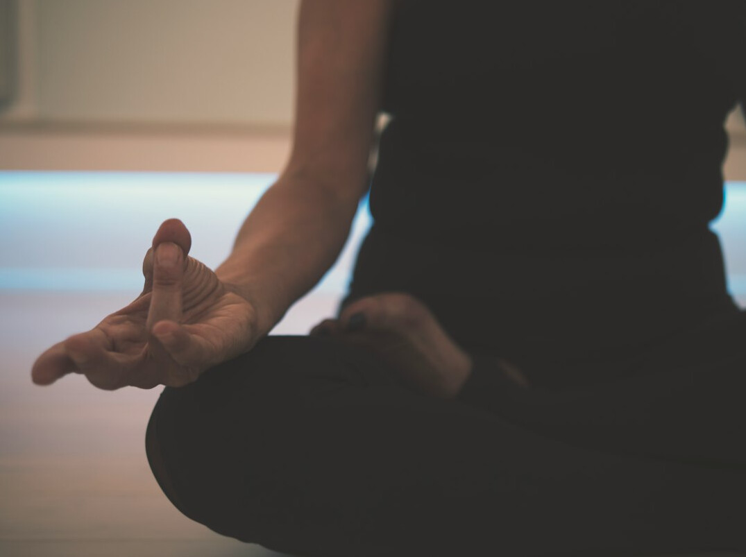 person meditating alone