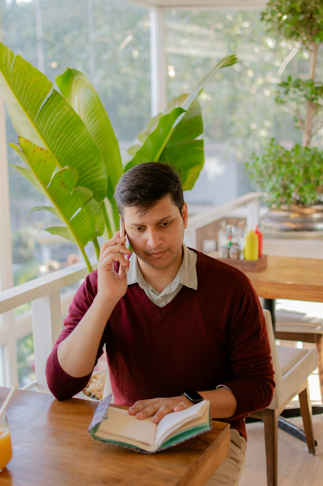 Brazilian man listening attentively while taking notes