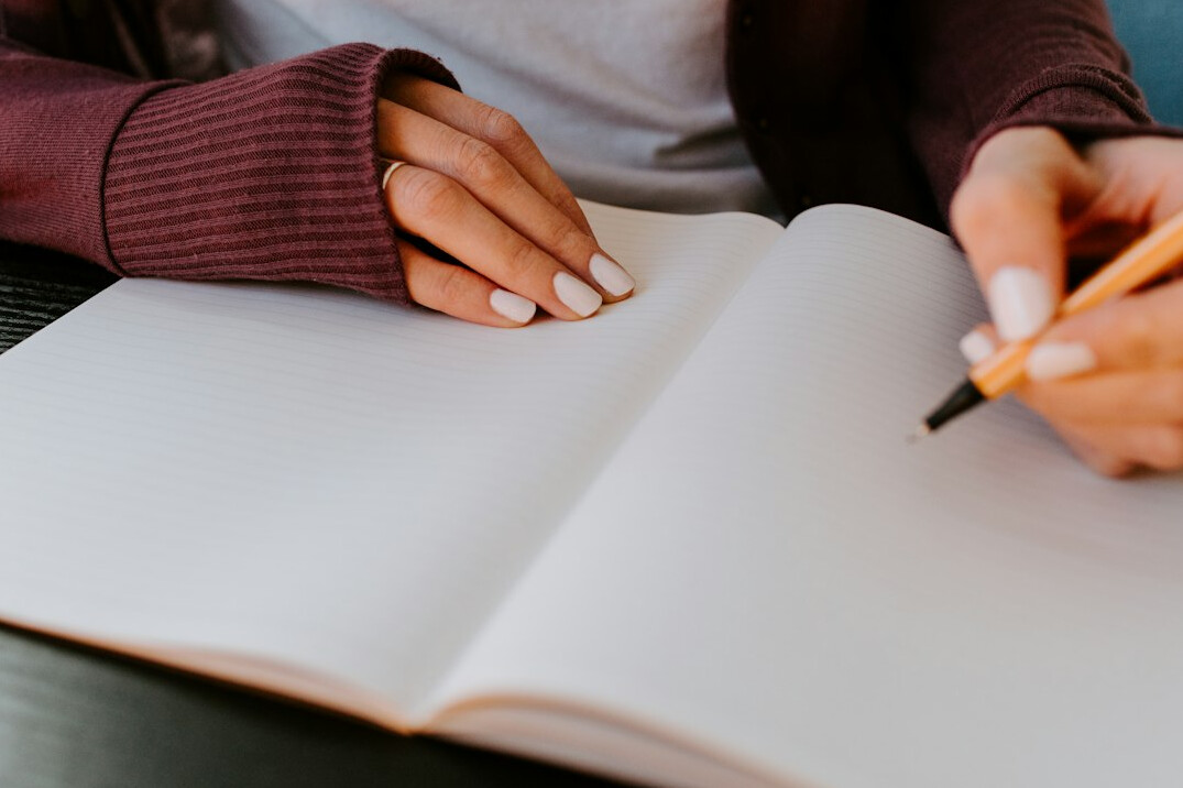 person writing notes