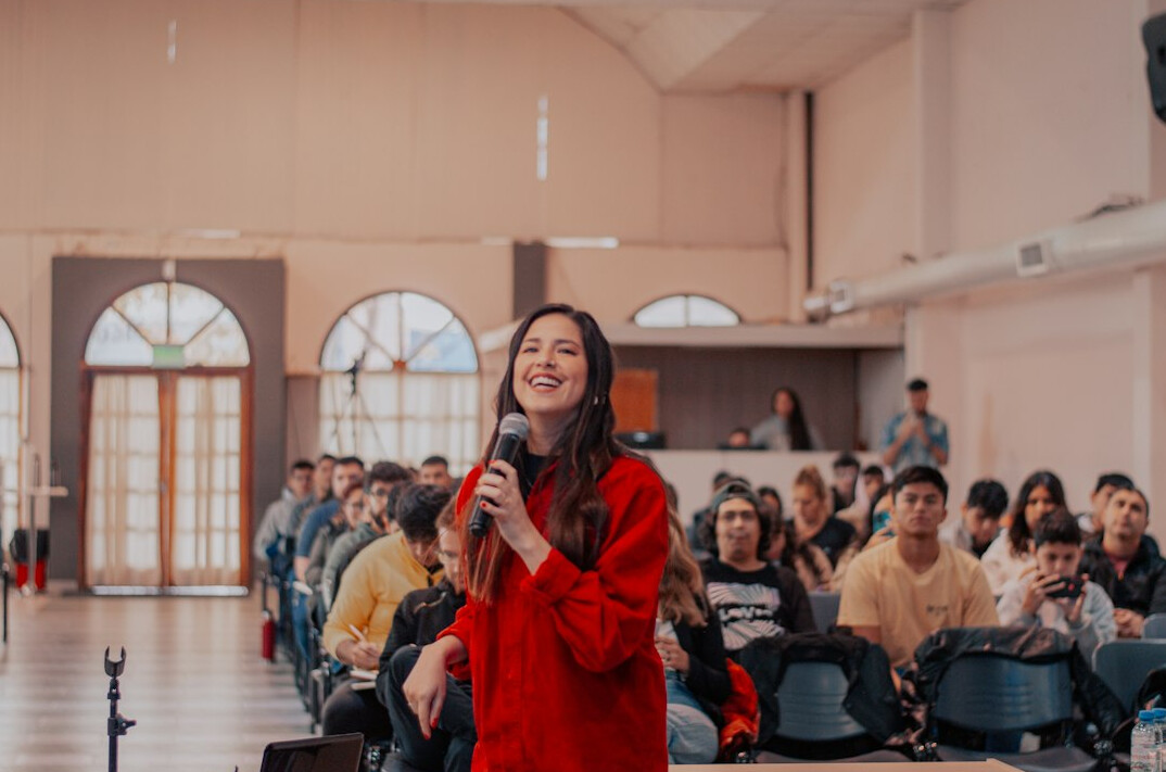 confident woman speaking on stage